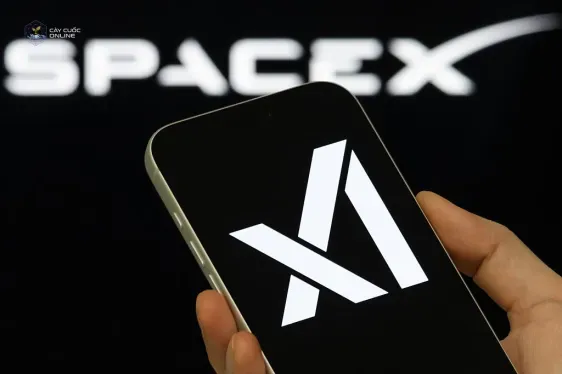 xAI Logo Shown On Smartphone With SpaceX Branding In Background